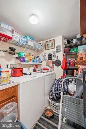 a work room with furniture and a flat screen tv