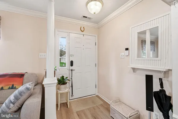 a view of a livingroom with furniture and wooden floor