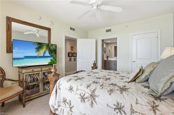 a living room with a couch and a chandelier