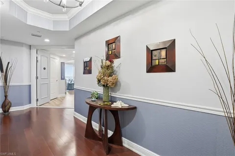 a view of entryway with livingroom and wooden floor