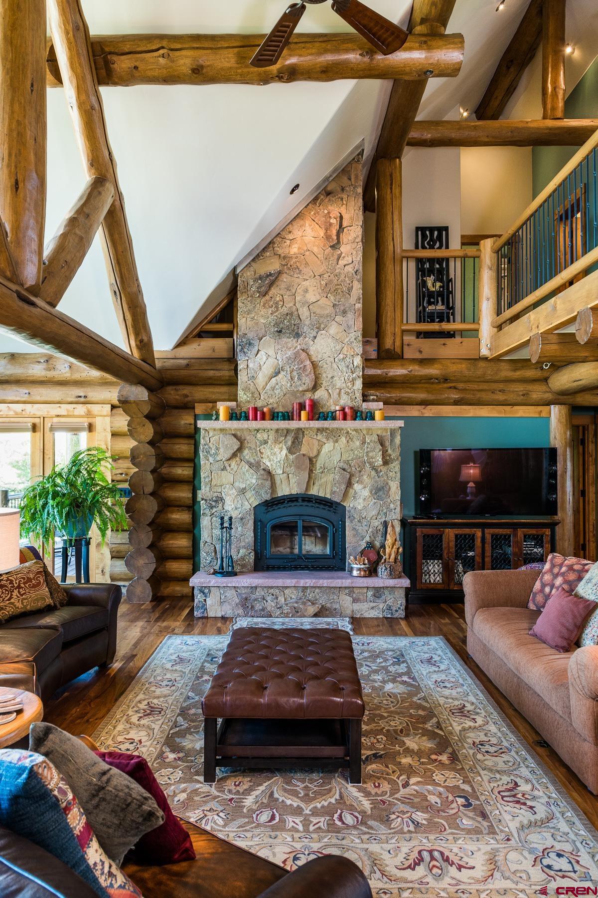 15255 Road 35 Mancos, CO 81328 - Photo 17 of 36 a living room with furniture and a fireplace