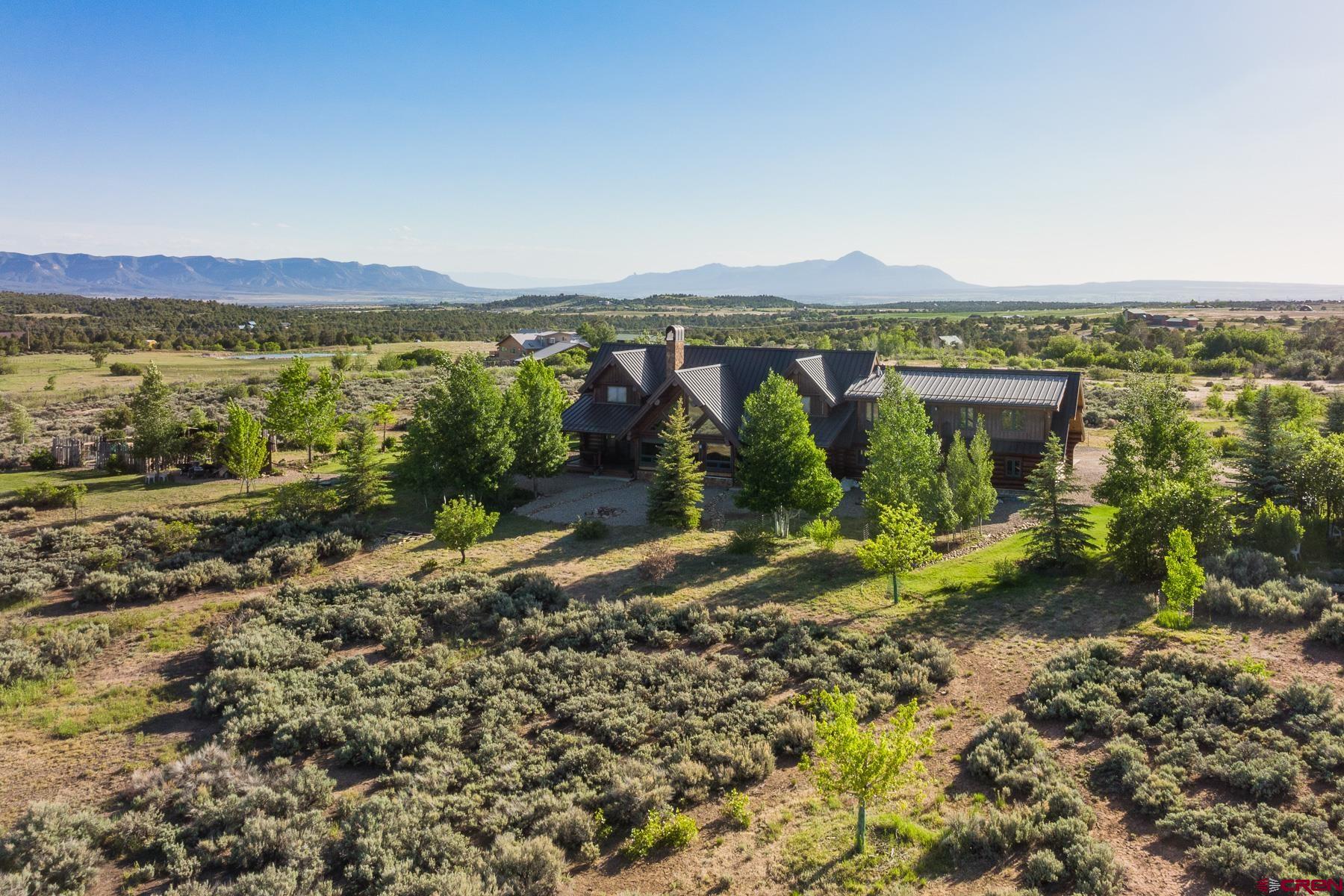 15255 Road 35 Mancos, CO 81328 - Photo 2 of 36 a view of a town with mountains in the background