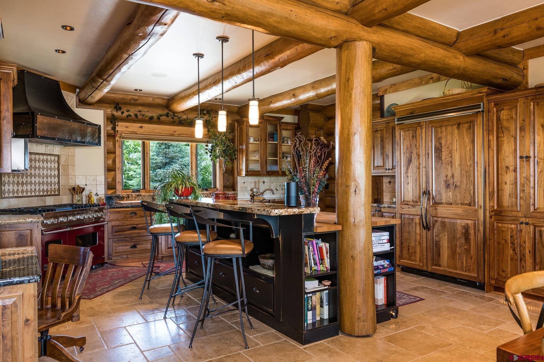 15255 Road 35 Mancos, CO 81328 - Photo 21 of 36 a view of a dinning room with granite countertop a table and chairs