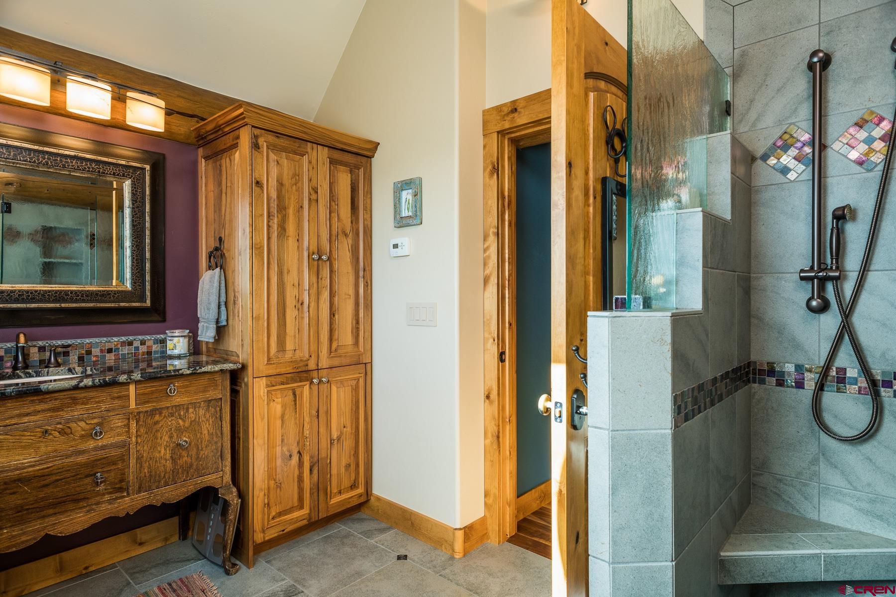 15255 Road 35 Mancos, CO 81328 - Photo 26 of 36 a bathroom with a sink and a mirror