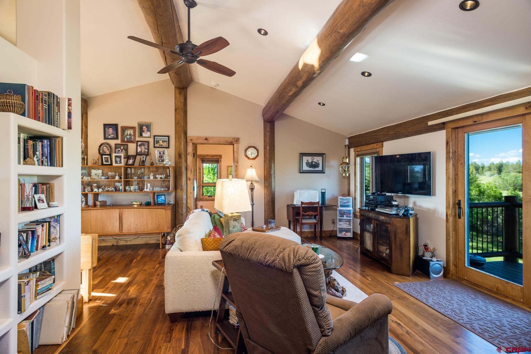 15255 Road 35 Mancos, CO 81328 - Photo 29 of 36 a living room with furniture and a flat screen tv