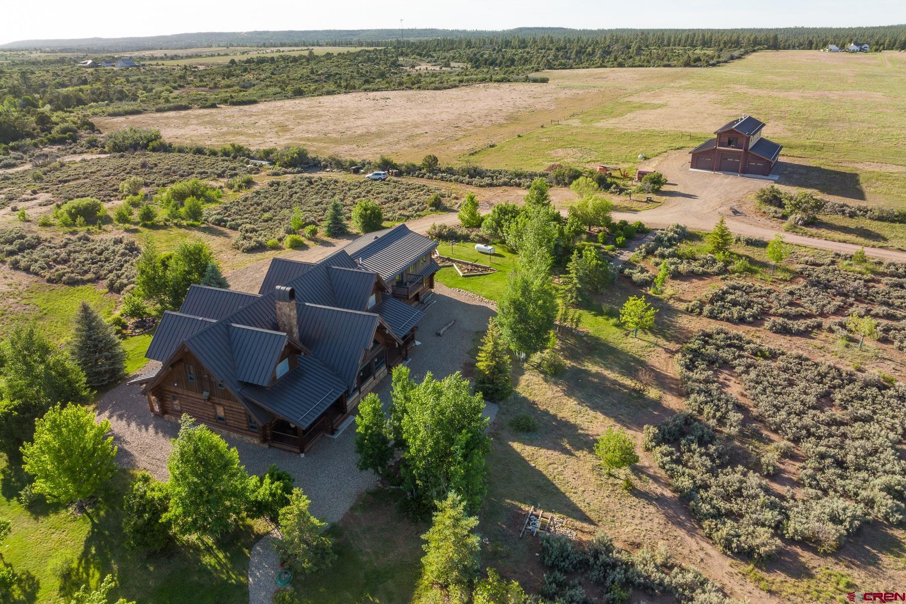 15255 Road 35 Mancos, CO 81328 - Photo 3 of 36 an aerial view of ocean with residential house and outdoor space