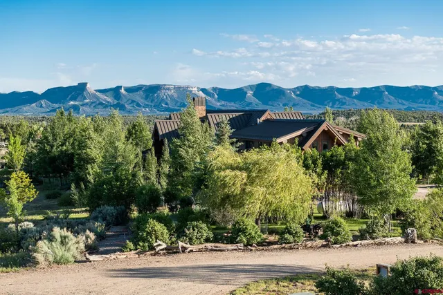 an aerial view of a house and yard
