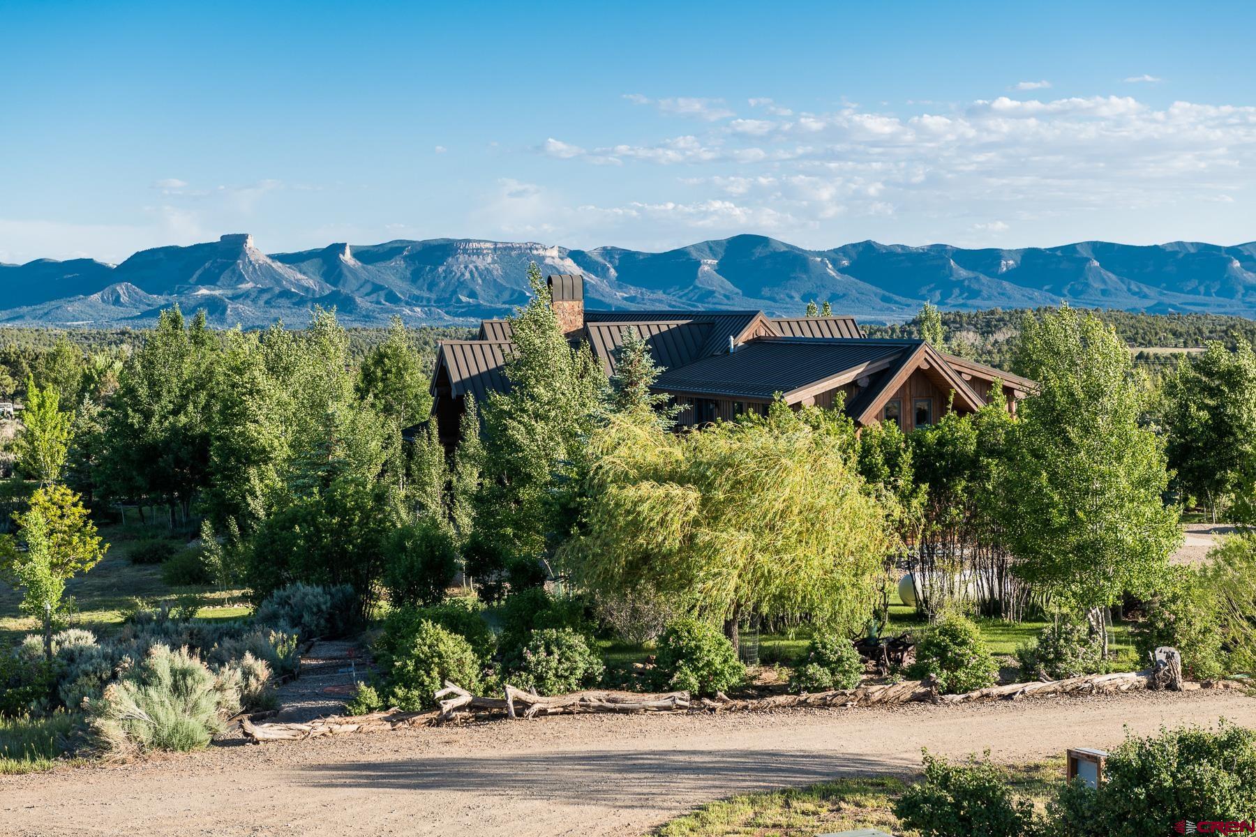 15255 Road 35 Mancos, CO 81328 - Photo 5 of 36 an aerial view of a house and yard