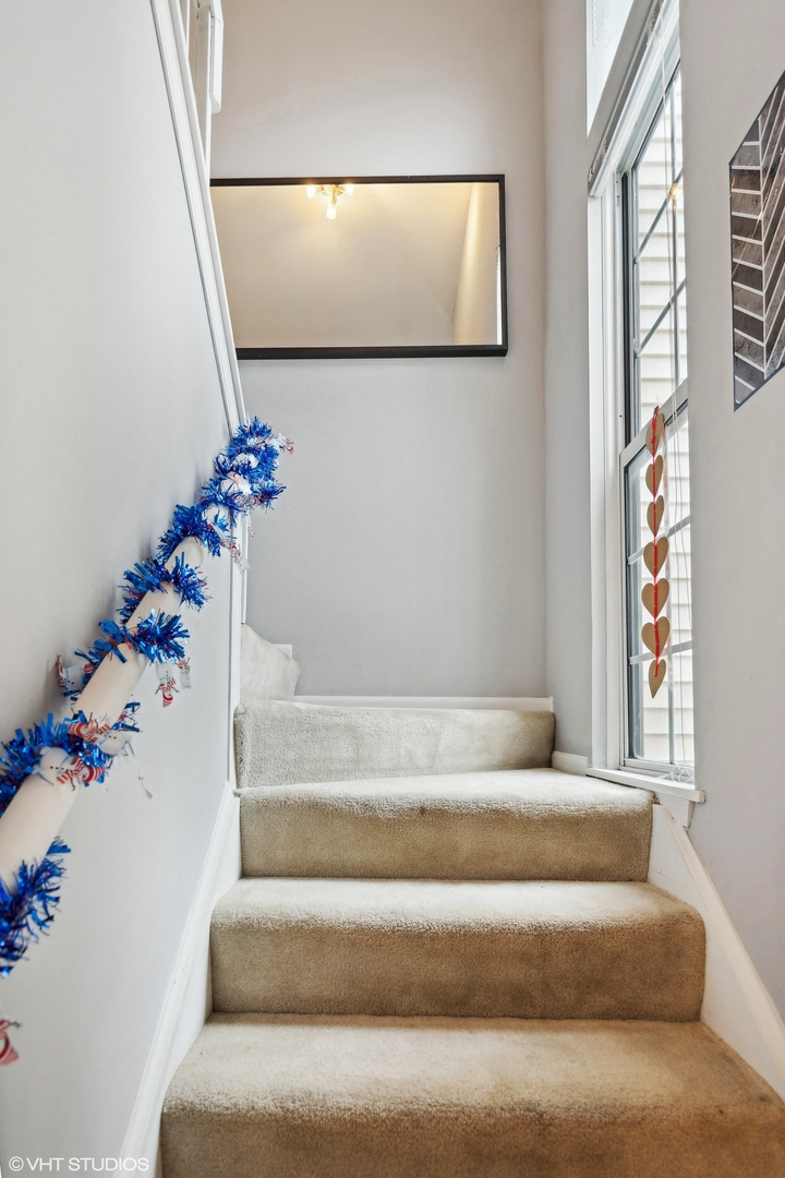 125 North Oltendorf Road Streamwood, IL 60107 - Photo 12 of 30 a view of staircase with rug and white walls