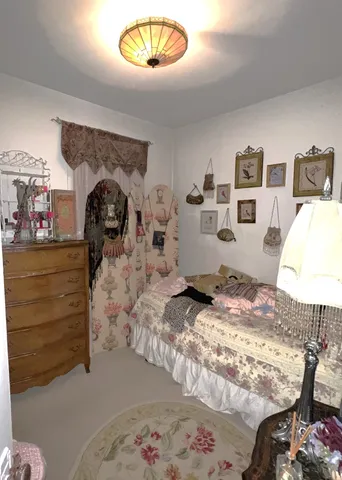 a living room with furniture toys and a window