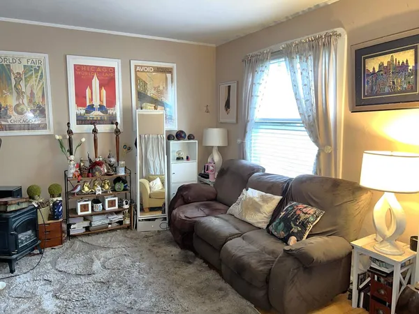 a kitchen with granite countertop a stove a sink dishwasher and a microwave oven with cabinets