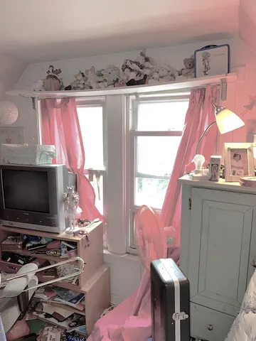 a view of a chairs and table in backyard