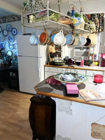 a kitchen with lots of counter top space and stove top oven