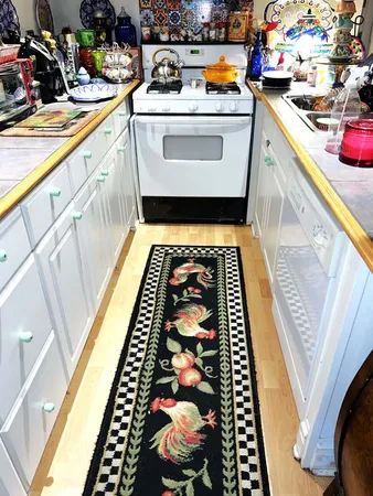 a utility room with sink and cabinets