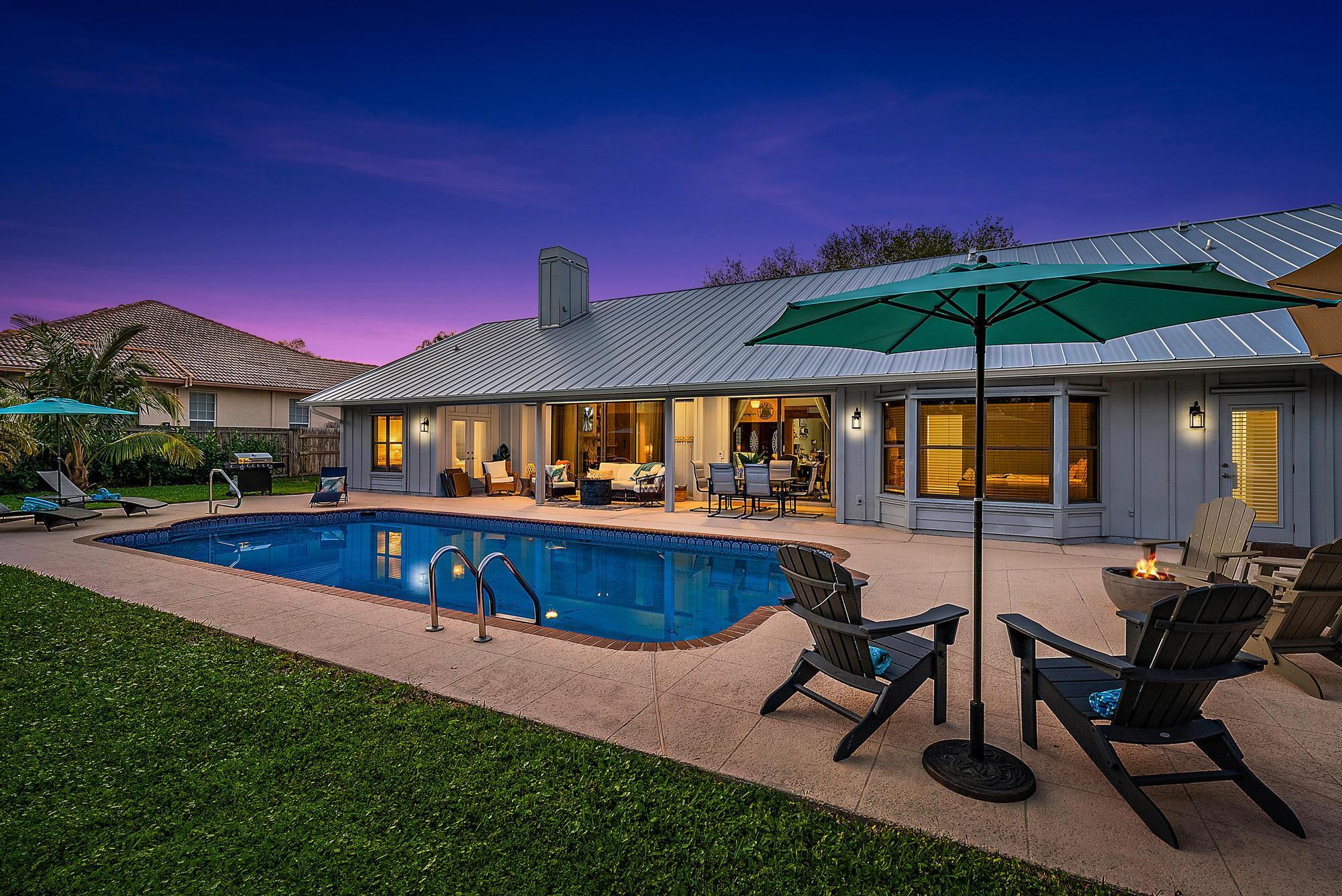 8422 Southeast Quail Ridge Way Hobe Sound, FL 33455 - Photo 31 of 42 Pool Patio Night 2