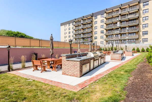 a view of a building with outdoor seating