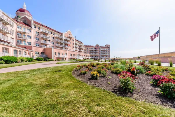 a picture of street with view of building and trees in the background
