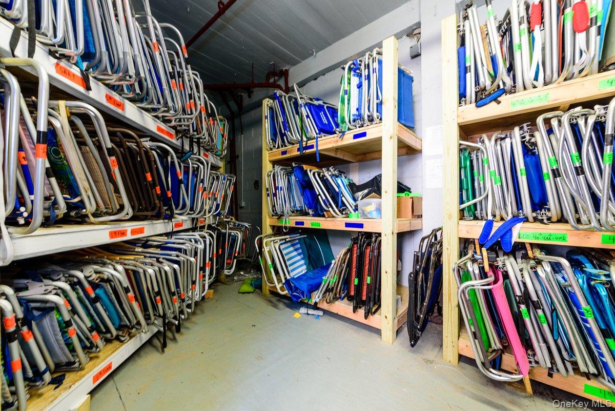 2 Richmond Road, Unit 5E Lido Beach, NY 11561 - Photo 26 of 27 a view of walk in closet with clothes and shoes