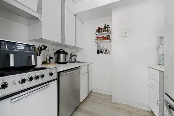a kitchen with stainless steel appliances a sink and a stove