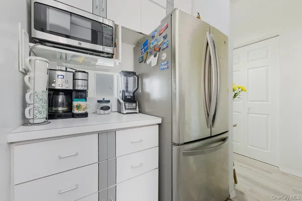 a kitchen with stainless steel appliances a refrigerator and a sink