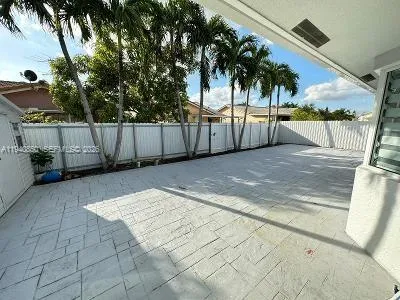 a view of a backyard of the house