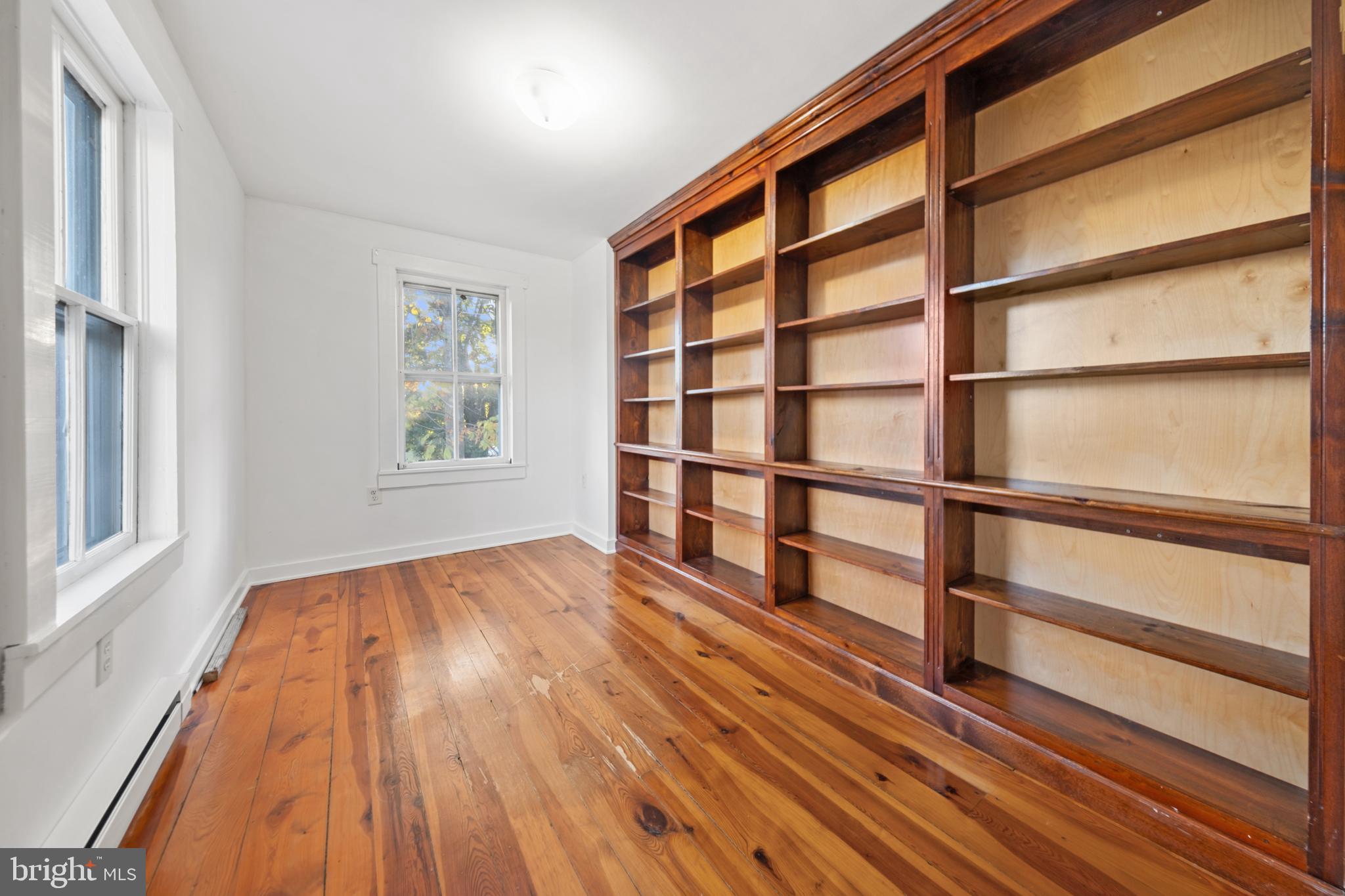 290 Howards Chapel Road Winchester, VA 22603 - Photo 16 of 33 a view of an empty room with wooden floor and a window