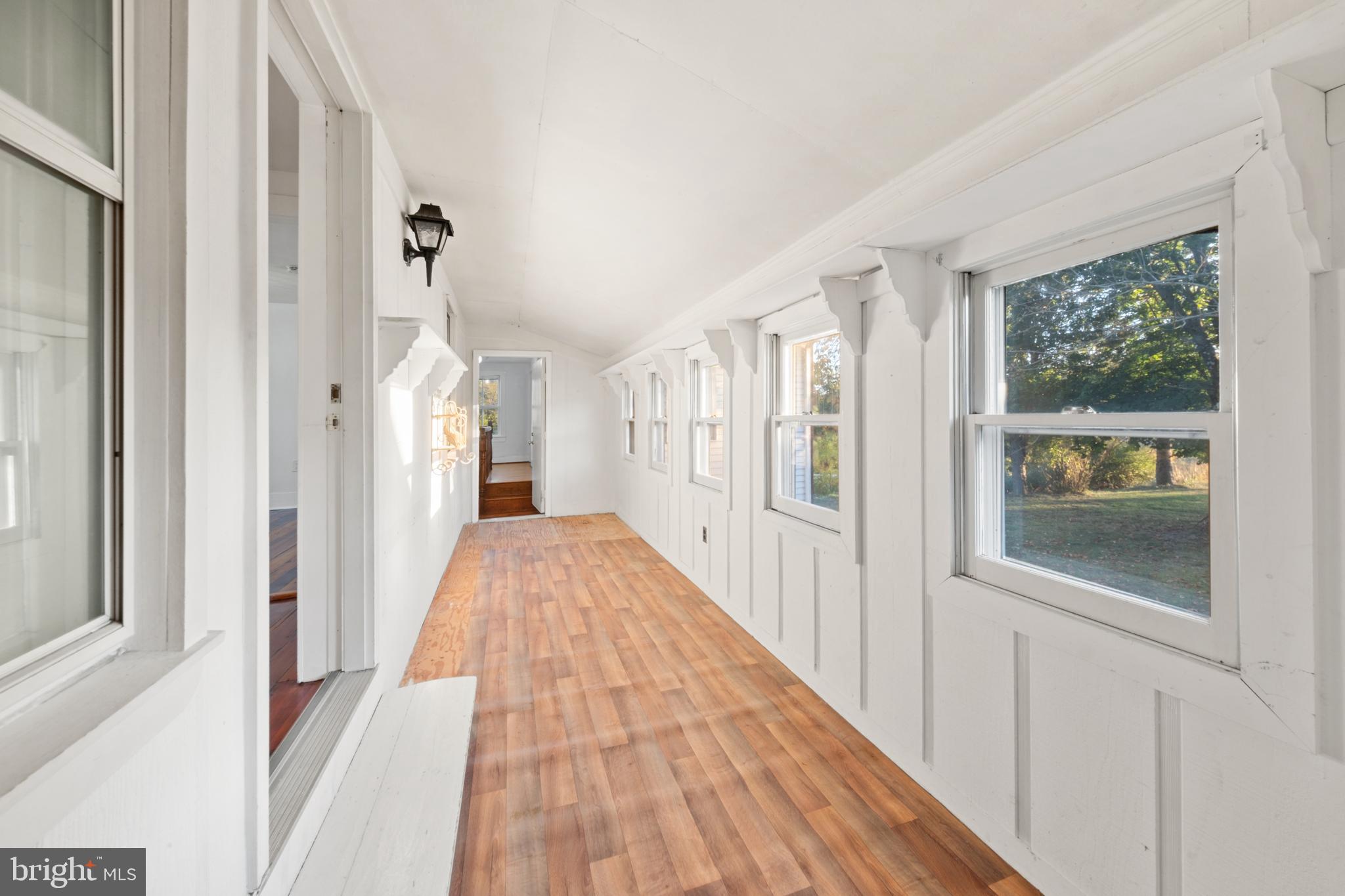 290 Howards Chapel Road Winchester, VA 22603 - Photo 18 of 33 a view of a hallway with wooden floor and windows