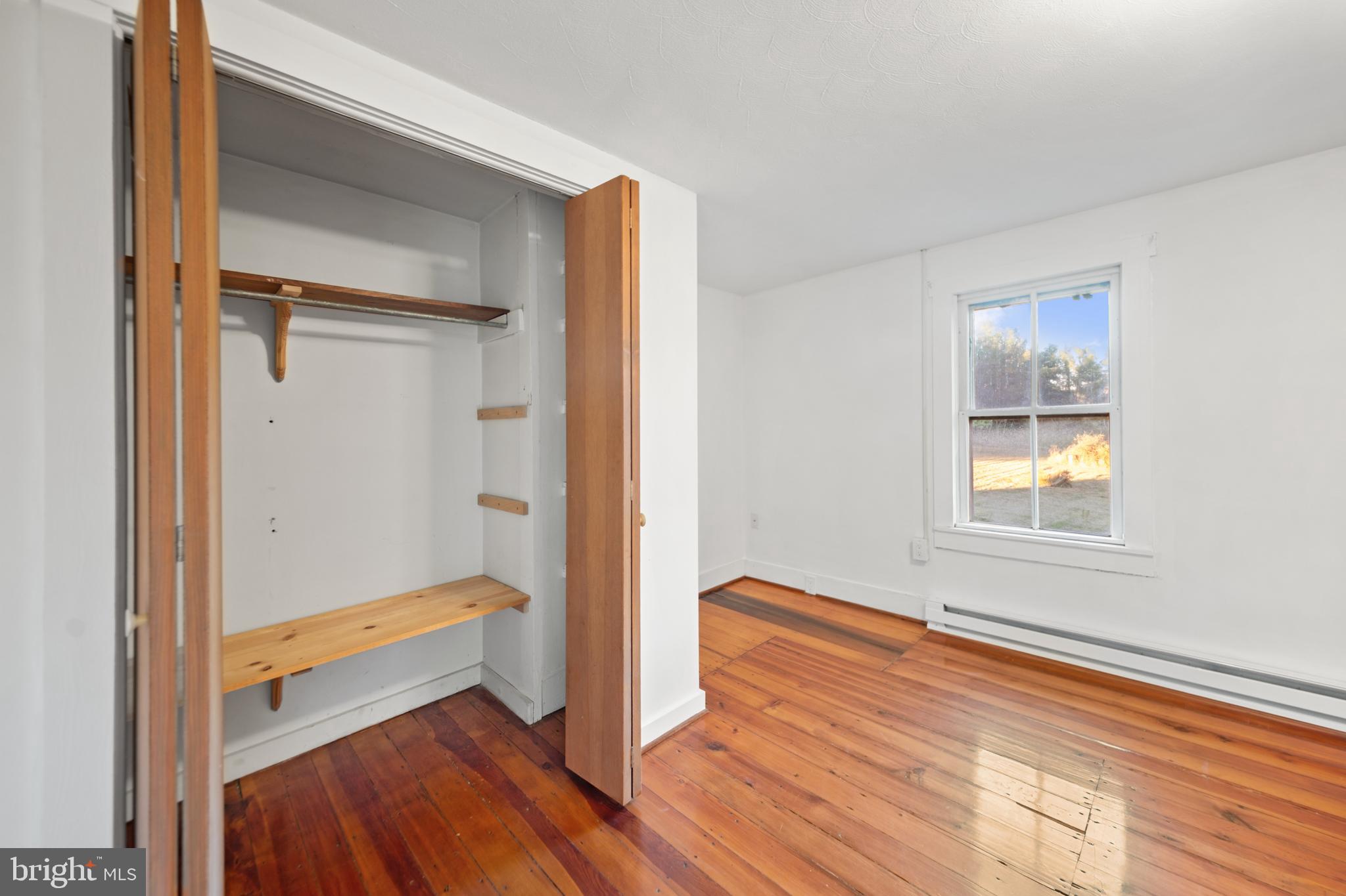 290 Howards Chapel Road Winchester, VA 22603 - Photo 20 of 33 a view of an empty room and wooden floor