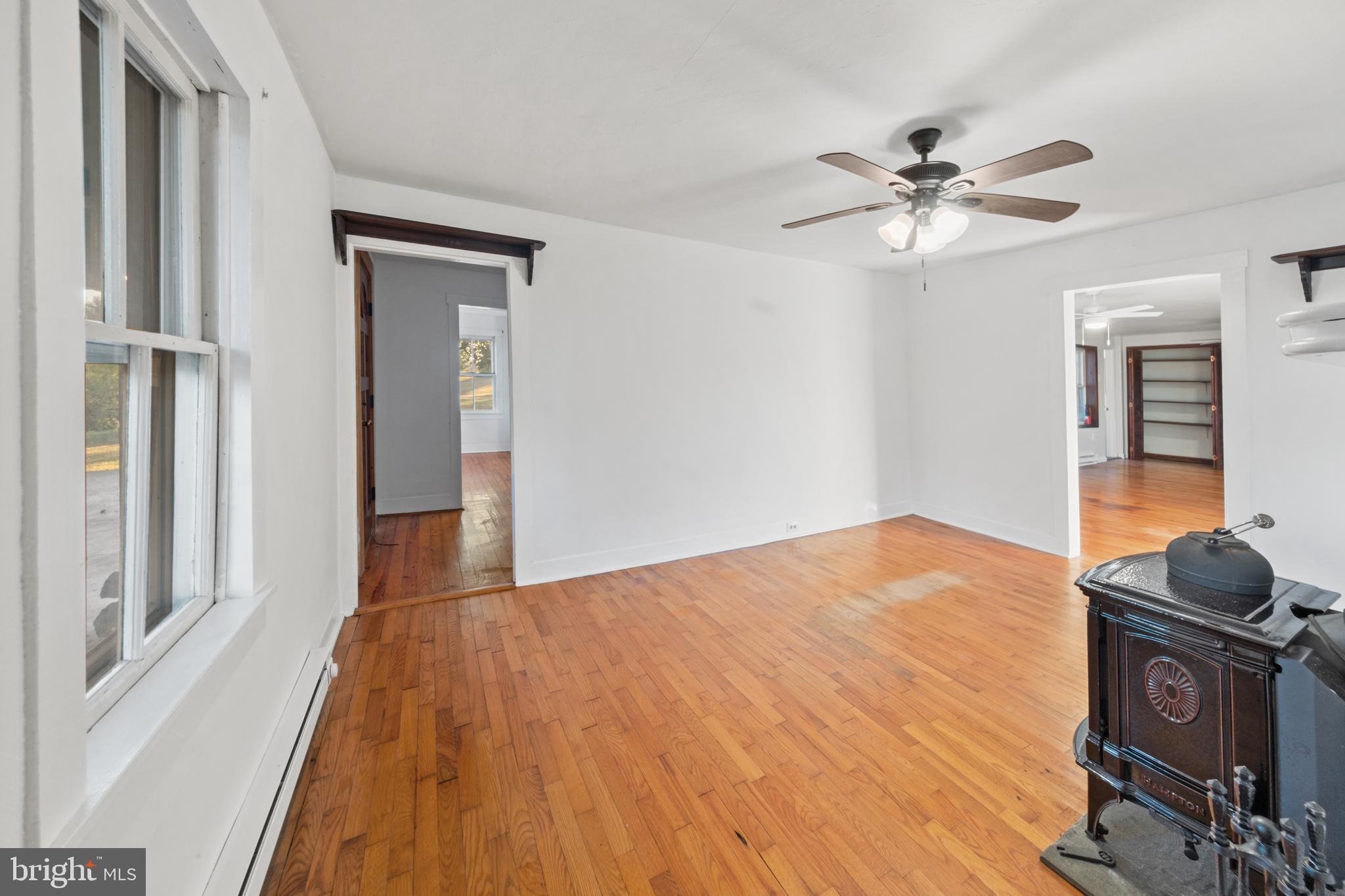 290 Howards Chapel Road Winchester, VA 22603 - Photo 26 of 33 a bedroom with a bed and wooden floor