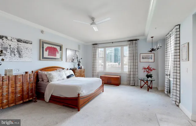 a spacious bathroom with a granite countertop sink and a mirror