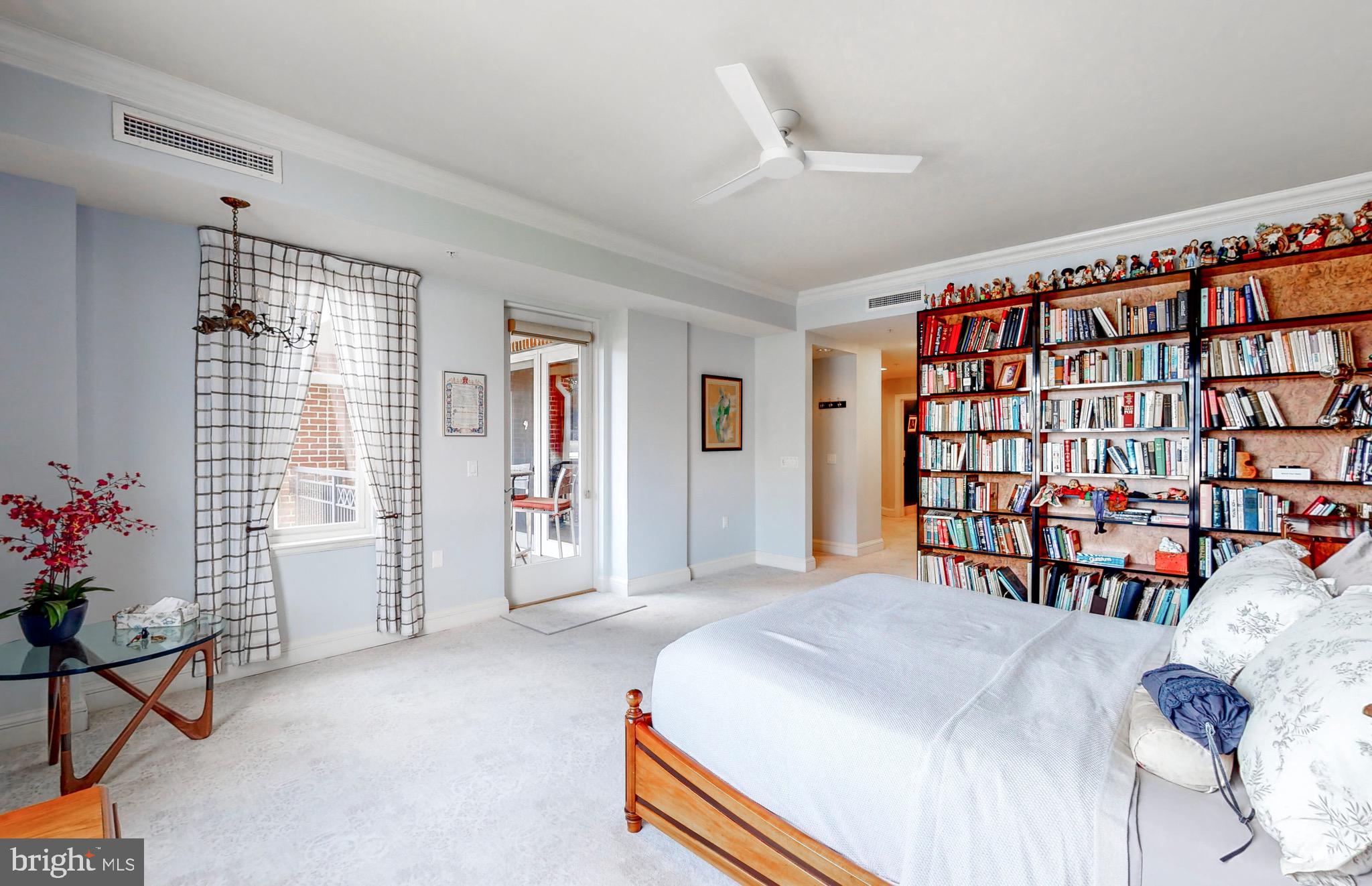 801 Key Highway, Unit T11 Baltimore, MD 21230 - Photo 22 of 86 a bedroom with a bed and a window