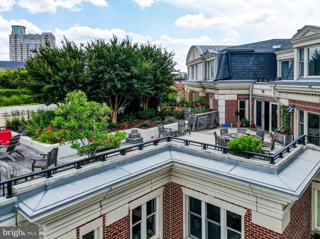 a swimming pool with outdoor seating and yard