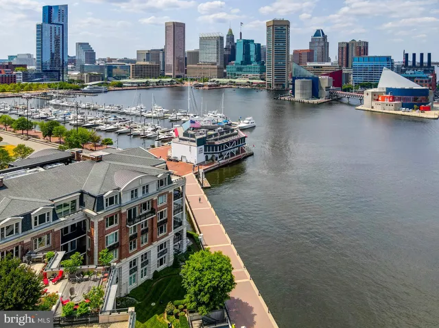 a view of a house with a tree in the background