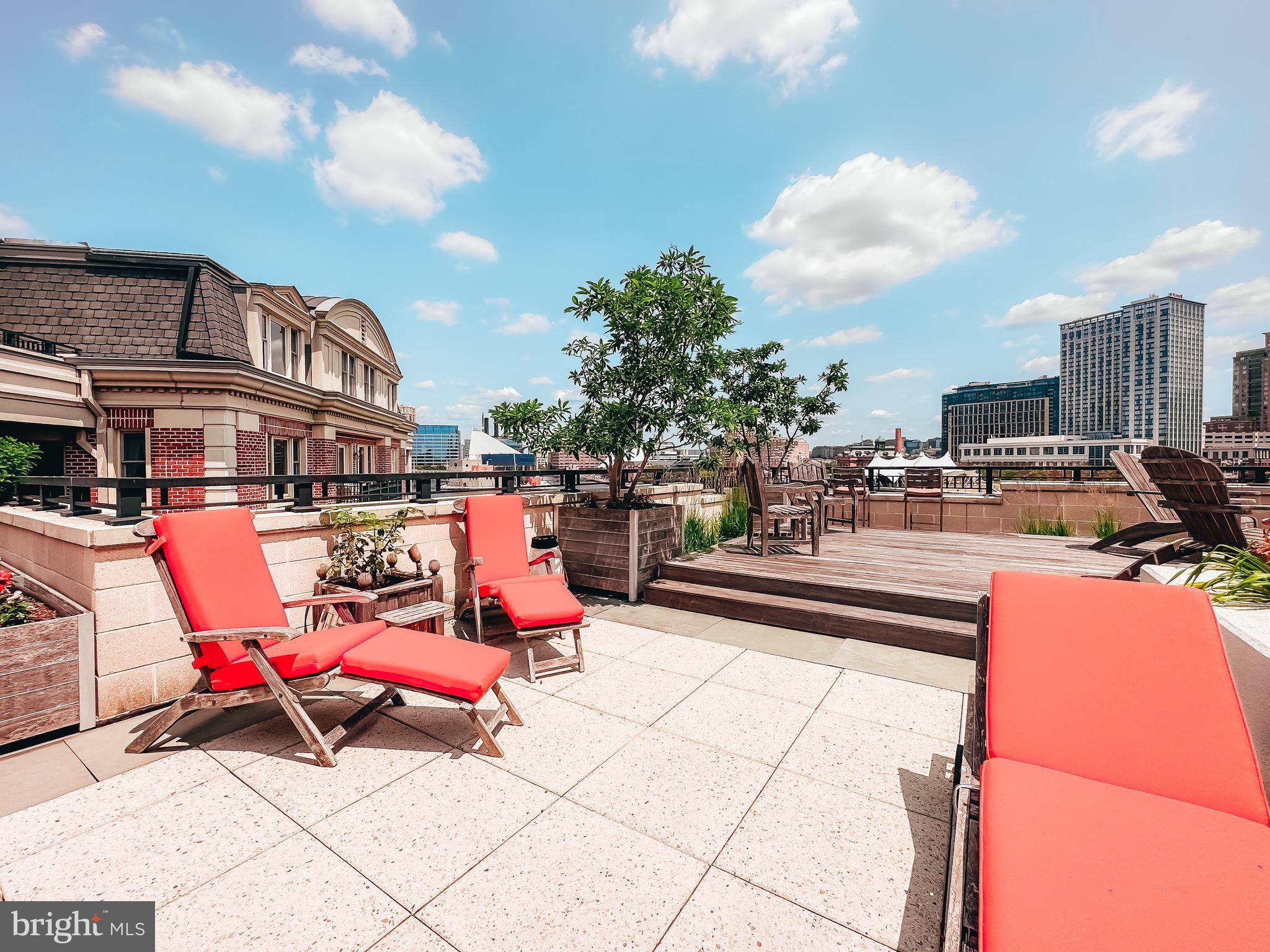 801 Key Highway, Unit T11 Baltimore, MD 21230 - Photo 67 of 86 a outdoor space with lots of chairs and a potted plant