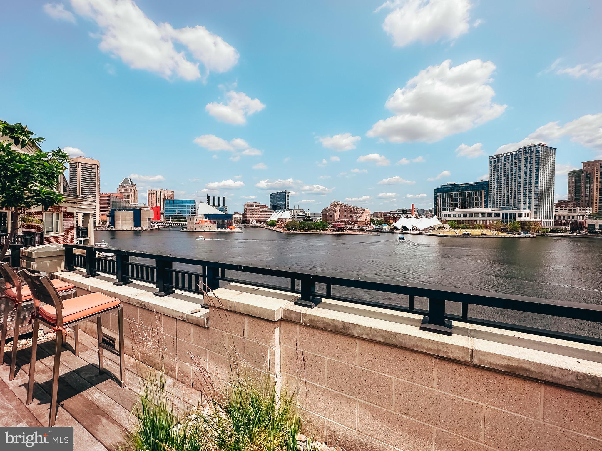 801 Key Highway, Unit T11 Baltimore, MD 21230 - Photo 79 of 86 a view of a swimming pool with a terrace and seating space