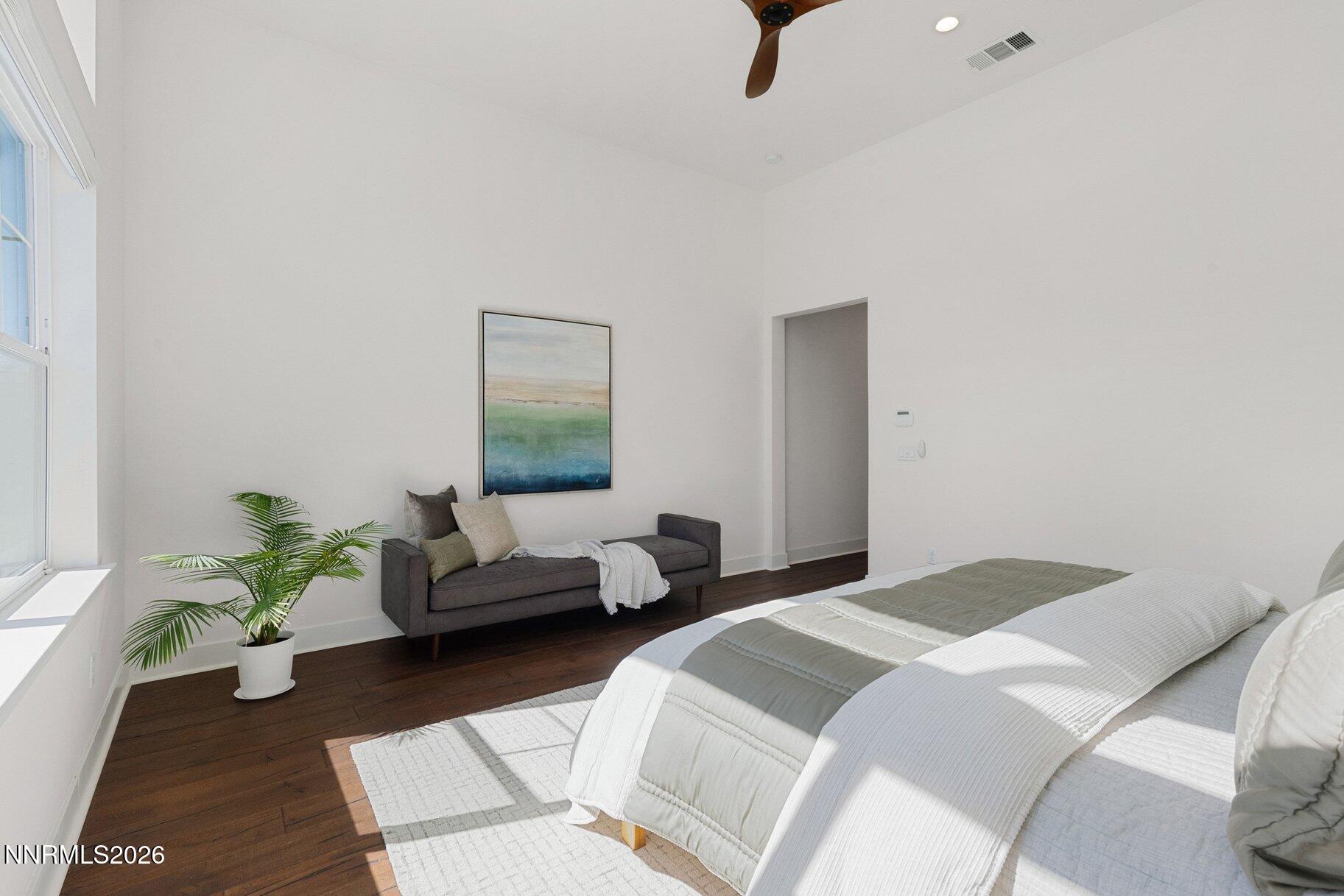 6110 South Pleasant Oak Trail Reno, NV 89511 - Photo 20 of 66 a bedroom with a bed and a couch