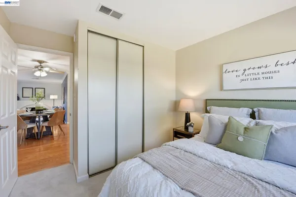 a bedroom with a bed and a table