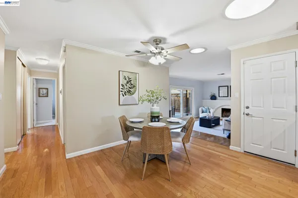 a view of a dining room with furniture window and wooden floor