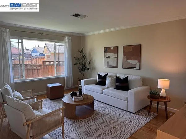 a living room with furniture and large window