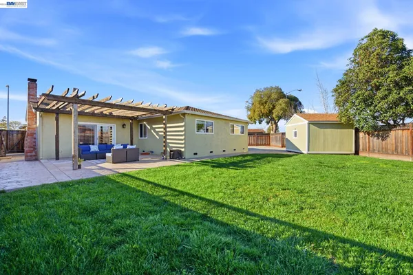 a view of a house with a back yard