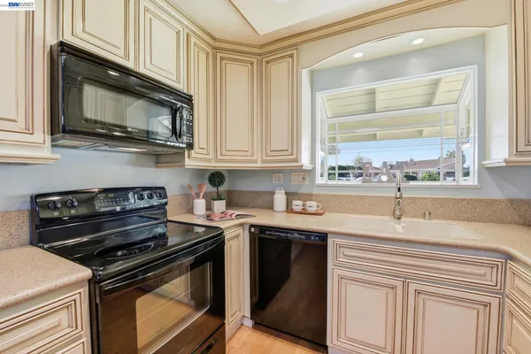 a kitchen with a stove and a microwave