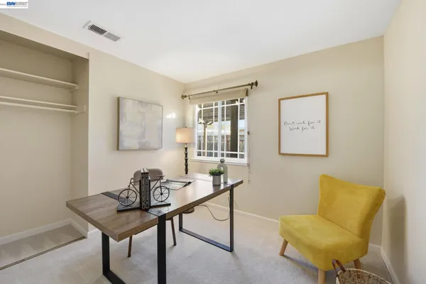 a view of a livingroom with furniture and a wooden table