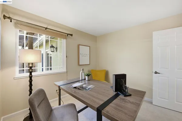 a workspace with furniture and window