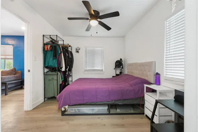 a bedroom with a bed and a walk in closet