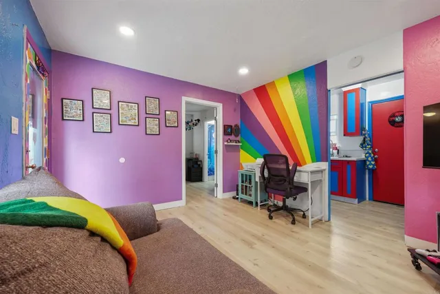 a bedroom with a bed and a workspace