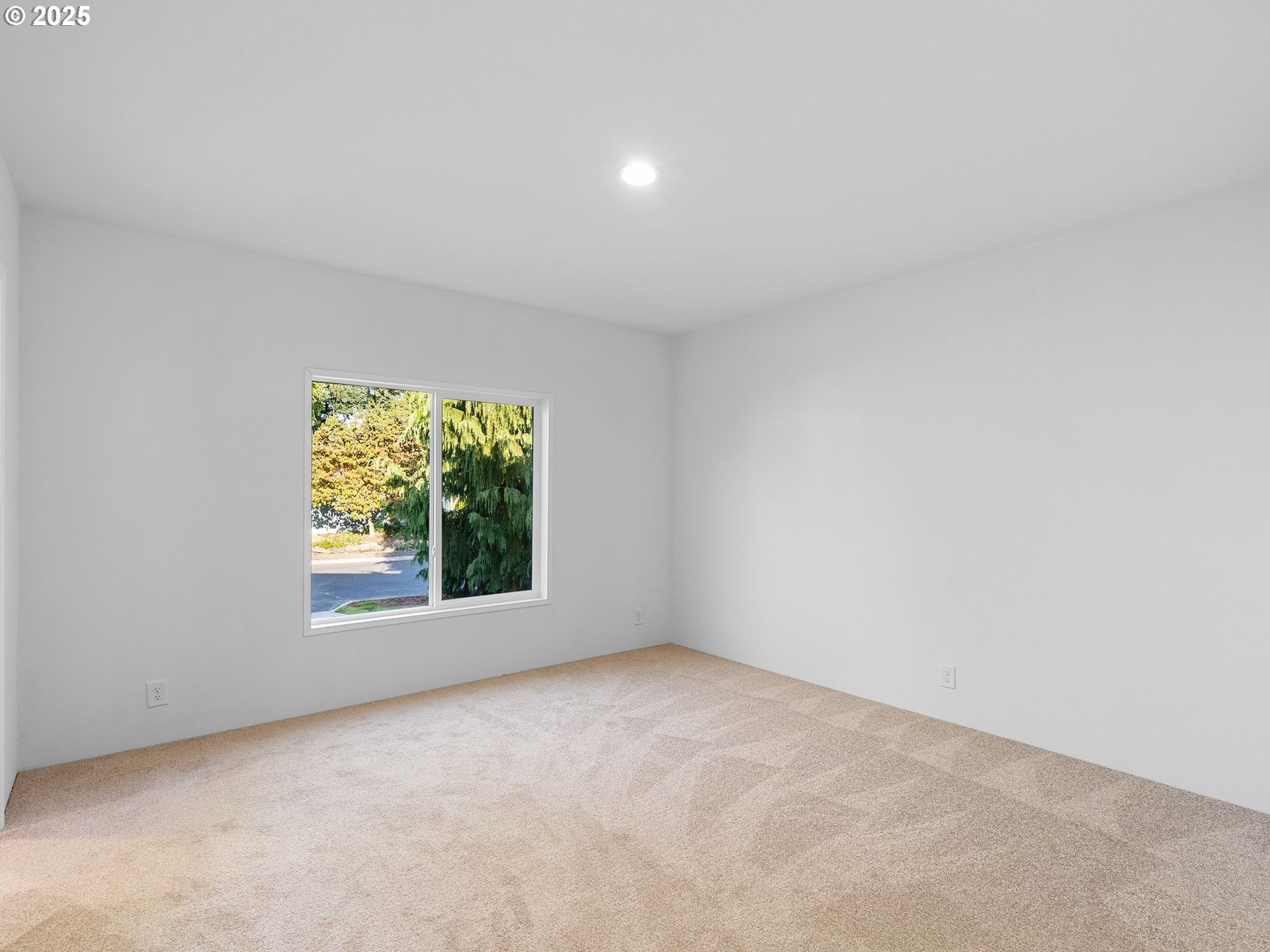 12904 Southeast Ramona Street Portland, OR 97236 - Photo 15 of 35 an empty room with a window