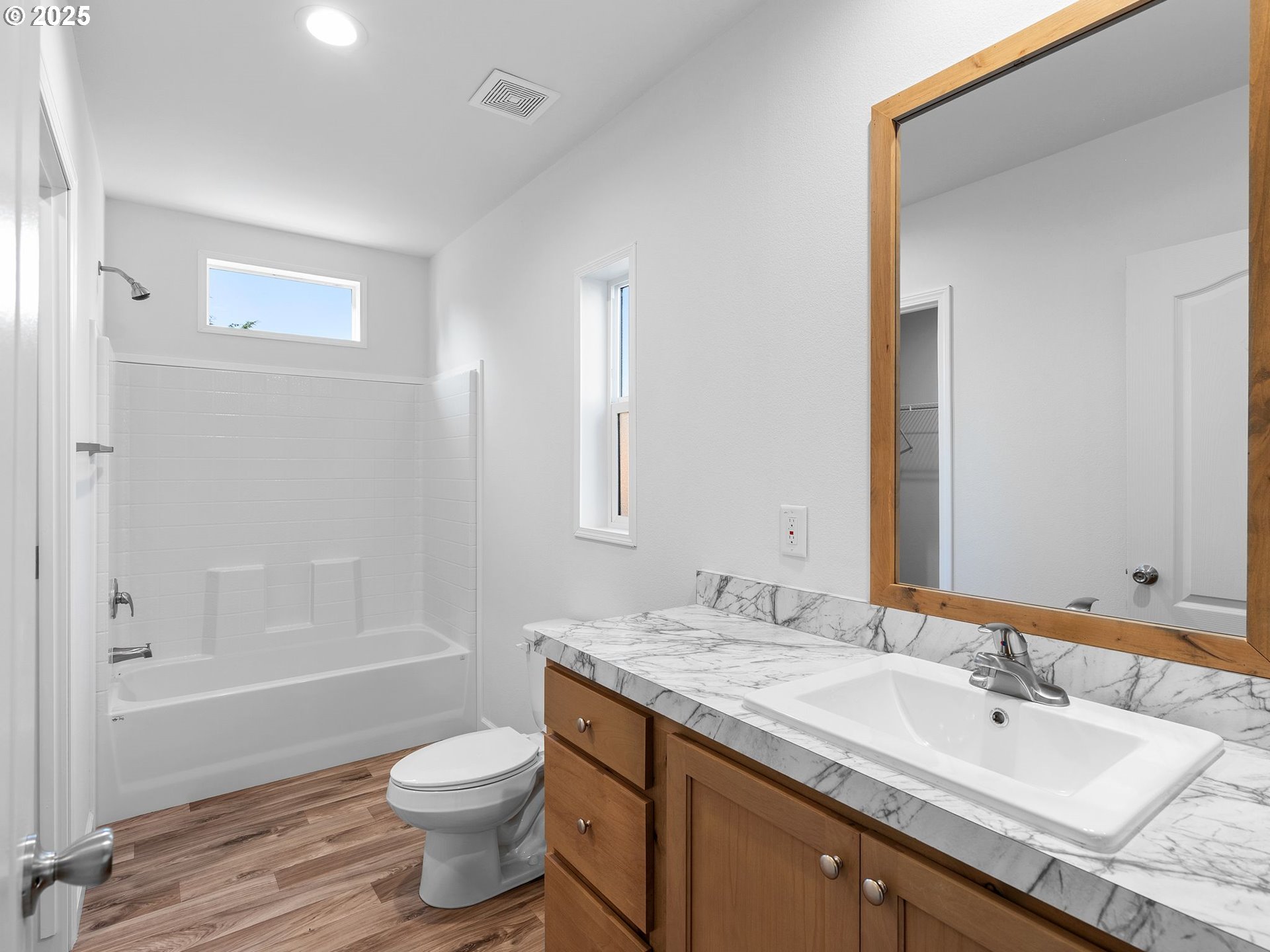 12904 Southeast Ramona Street Portland, OR 97236 - Photo 18 of 35 a bathroom with a granite countertop sink toilet and shower