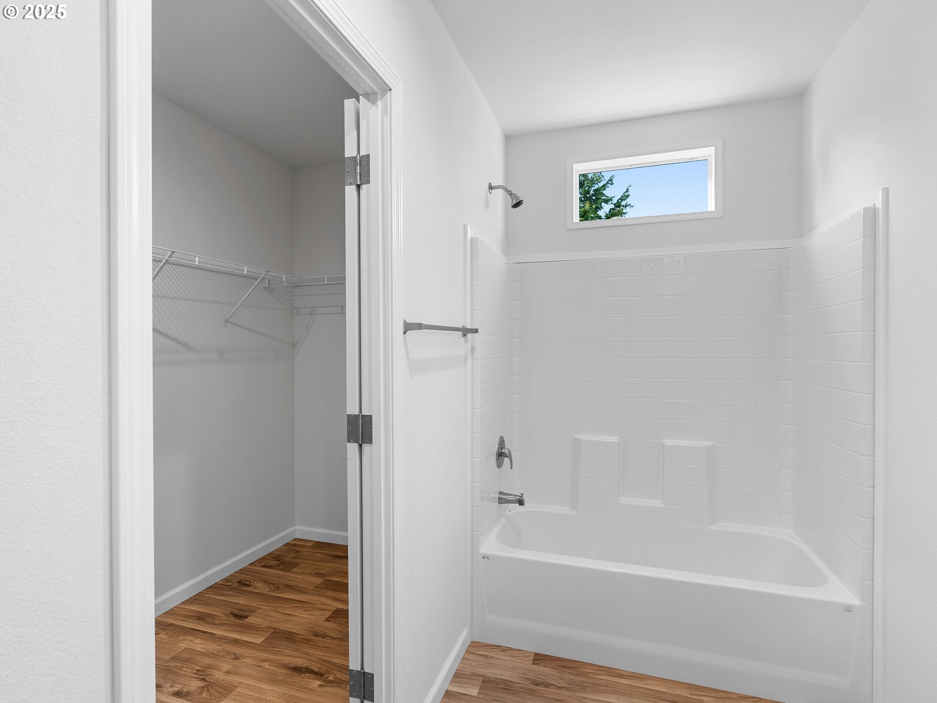 12904 Southeast Ramona Street Portland, OR 97236 - Photo 19 of 35 a bathroom with a bathtub and a shower