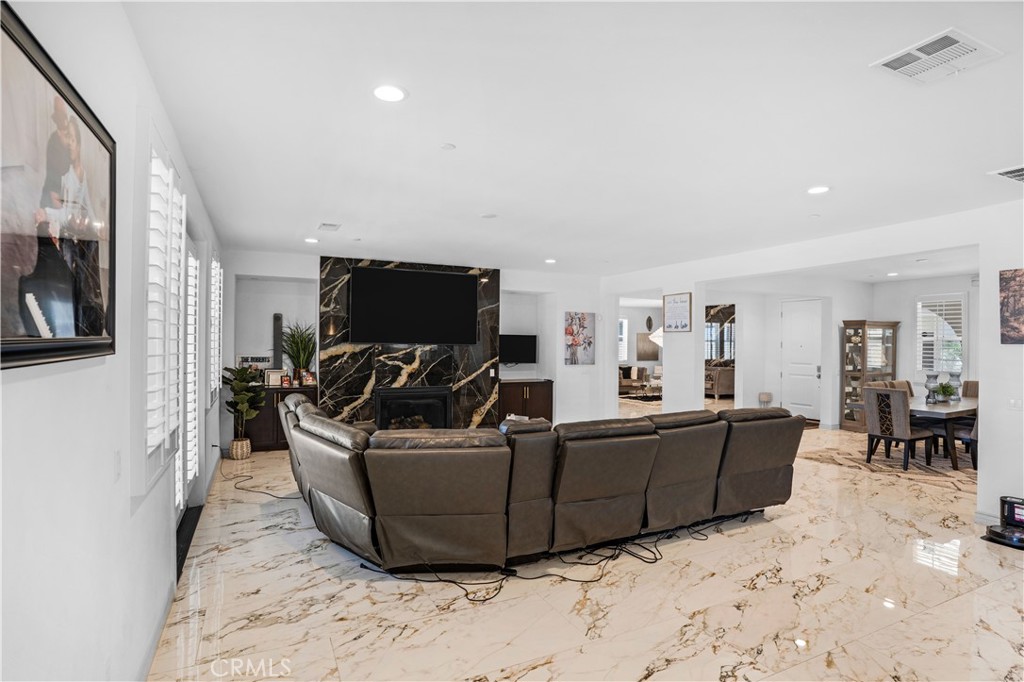 17195 Compass Drive Riverside, CA 92503 - Photo 15 of 75 a living room with furniture and a flat screen tv