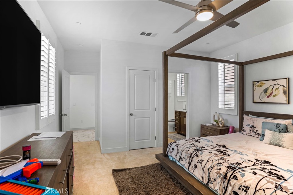 17195 Compass Drive Riverside, CA 92503 - Photo 30 of 75 a bedroom with a bed and a couch